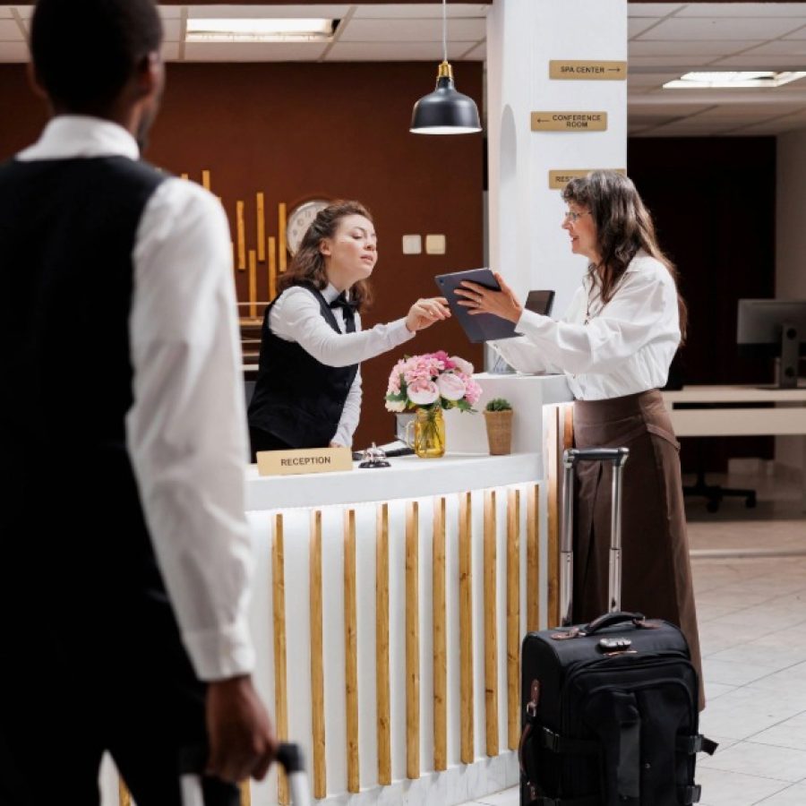 Adobe Express - travel_senior-woman-assisted-hotel-arrival